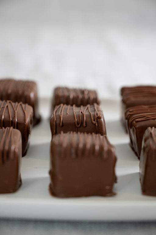 Homemade Dulce de Leche Swirled Marshmallows Dipped in Milk Chocolate.